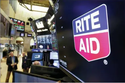  ?? RICHARD DREW — THE ASSOCIATED PRESS ?? The logo for Rite Aid is displayed Thursday above a trading post on the floor of the New York Stock Exchange. Rite Aid and the grocer Albertsons called off an agreement to become a single company with the deal facing shaky prospects in a shareholde­r vote.