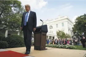  ?? Evan Vucci / Associated Press ?? President Trump leaves a White House briefing. He falsely accused the New York Times of using “illegally obtained informatio­n” in its report on his taxes.