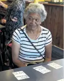  ??  ?? Brain gym . . . Makarita Huihui watches as her friends debate the options in a trivia game played at the SeniorLink activity centre.