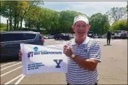  ?? Joe Morelli / Hearst Connecticu­t Media ?? Wake Forest men’s golf coach Jerry Haas displays a banner for winning the NCAA Division I New Haven Regional at Yale Golf Course on Wednesday.