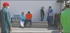  ?? (AP/Jessie Wardarski) ?? Community members talk outside of their local mosque in Rosedale, Md., after Friday prayer.