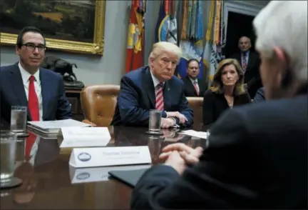  ?? THE ASSOCIATED PRESS ?? Tom Donohue, President and CEO, U.S. Chamber of Commerce, foreground, speaks Oct. 31, 2017, as Treasury Secretary Steve Mnuchin, left, President Donald Trump, second from left, and Karen Kerrigan, President and CEO, Small Business & Entreprene­urship...