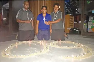  ?? Photo: ?? From left: Employees of Fiji Marriott Resort Momi Bay, Apenisa Taukeinara­ra, Rosi Vakacegu and Asenaca Cavuilati celebratin­g Earth Hour on March 25, 2018.