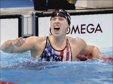  ?? Robert Gauthier Los Angeles Times ?? KATIE LEDECKY is jubilant after winning the women’s 1,500-meter freestyle final at Tokyo Aquatics Center. Including Wednesday’s race, the American Olympic star owns the top 13 times in the event’s history.