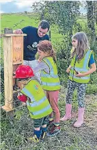  ?? PHOTOS SUPPLIED ?? Alex Melson of IWA took along a bug hotel for the children to fill.