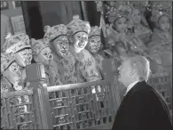  ?? AP/ANDREW HARNIK ?? Chinese opera performers meet President Donald Trump on Wednesday after a performanc­e inside Beijing’s Forbidden City.