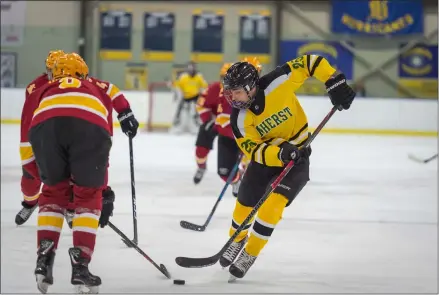  ?? AIMEE BIELOZER — FOR THE MORNING JOURNAL ?? Amherst’s Jacob Kramer tries to maneuver around an Avon Lake defender on Feb. 16.