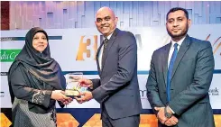  ??  ?? Commercial Leasing and Finance PLC Director and CEO Krishan Thilakarat­ne receiving the award for the Islamic Finance Entity of the Year