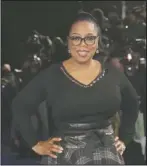  ?? The Associated Press ?? BOOK PICK: Actress Oprah Winfrey posing for photograph­ers upon arrival at the premiere of the film 'A Wrinkle In Time' in London on March 13. Winfrey has chosen Michelle Obama’s “Becoming” as her next book club pick, The Associated Press has learned.