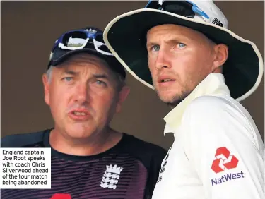  ??  ?? England captain Joe Root speaks with coach Chris Silverwood ahead of the tour match being abandoned