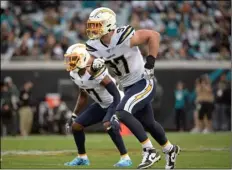  ?? M Ebenhack
AP Photo/Phelan ?? In this 2019 file photo, Los Angeles Chargers defensive end Joey Bosa (97) follows a play during the first half of an NFL football game against the Jacksonvil­le Jaguars in Jacksonvil­le, Fla.