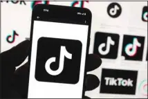  ?? ?? The TikTok logo is seen on a cellphone on Oct. 14, 2022, in Boston. China’s government said Thursday, March 23, it would oppose possible US plans to force TikTok’s Chinese owner to sell the short-video service as a security risk and warned such a move would hurt investor confidence in the United States. (AP)