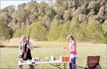  ?? RACHEL DICKERSON/MCDONALD COUNTY PRESS ?? Allen Treadwell, USA Olympic trap and skeet team member, left, puts on a shooting demonstrat­ion for youth at the Young Outdoorsme­n United youth wing shooting seminar on Saturday.