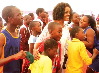  ?? by Kudakwashe Hunda — Picture ?? First Lady and Patron of Danhiko Industrial Training College Amai Grace Mugabe is joined on the dance floor by children from different schools after officially opening the 28th edition of the Danhiko Annual Paralympic Games in Harare yesterday