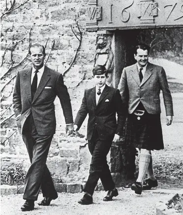  ??  ?? Fit for a prince: Charles with his father Philip on his first day at Gordonstou­n in 1962