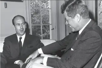  ?? AFP via Getty Images 1962 ?? ThenFrench Finance Minister Valery Giscard d’Estaing talks with President John F. Kennedy at the White House in 1962. Giscard was France’s president from 1974 to 1981.
