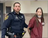  ?? PHOTO BY CARL HESSLER JR. ?? Everett Clayton is escorted by a sheriff’s deputy from a Montgomery County courtroom where he was arraigned on homicide charges in connection with fatal crash.