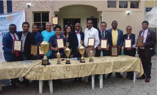  ??  ?? Rotarian Ikheloa (6th from right) flanked by award-winning club members during the event