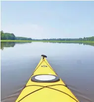  ?? CHELSEY LEWIS / MILWAUKEE JOURNAL SENTINEL. ?? Flat water makes for perfect paddling on the Turtle-Flambeau Flowage in Iron County.