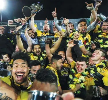  ?? PICTURES: Getty Images ?? We are the champions: the Hurricanes celebrate the title last season