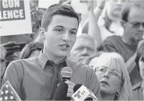  ?? RHONA WISE/AFP/GETTY IMAGES ?? Marjory Stoneman Douglas High School student Cameron Kasky speaks Saturday at a gun control rally in Fort Lauderdale, Fla. Kasky and his brother waited an hour before a SWAT team brought them to safety.