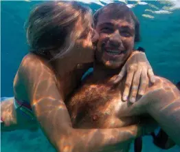  ??  ?? Loved diving: Madaline Cole, with boyfriend Ross Makulec