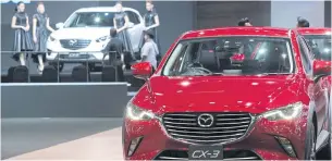  ?? TAWATCHAI KEMGUMNERD ?? Japanese carmaker Mazda has shown interest in making electric vehicles, saying incentives approved by the cabinet last week match its midterm business plan.