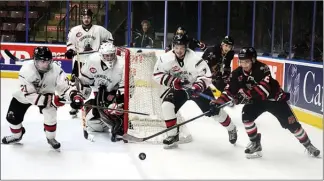  ?? DAVID CROMPTON/The Okanagan Sunday ?? Kelowna Chiefs forward Josh Kobelka tries to corral the puck against Summerland Steam defenceman Cole Williams as goalie Matthew Huber and forward Riley Pettitt look on Saturday at the SOEC in Penticton. The Steam won 2-1 to take the series 4-3.