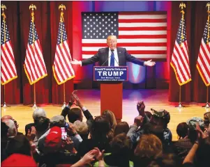  ?? AP PHOTO ?? Donald Trump speaks behind a DonaldTrum­pforVets.com sign at a fundraisin­g event in Des Moines, Iowa, at Drake University during Trump’s campaign for president. New York Attorney General Barbara Underwood filed a lawsuit Wednesday accusing Trump of illegally using his charitable foundation to pay legal settlement­s related to his golf clubs and to bolster his presidenti­al campaign.