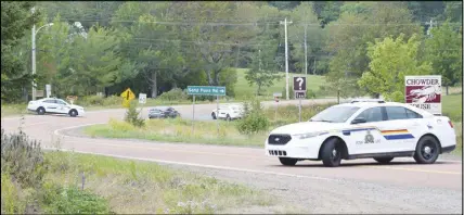  ?? Harry sullivaN/truro daily NeWs ?? Highway 6 East leading to River John, just across the bridge from Tatamagouc­he, was closed to traffic throughout the day Monday while RCMP officers investigat­ed the scene at the Lockerbie Memorial Cemetery of a gunfire exchange between police and a...