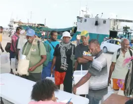  ??  ?? Ambae evacuees who had just arrived on the boat are being registered.