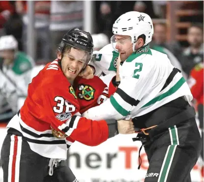  ?? | JONATHAN DANIEL/ GETTY IMAGES ?? Ryan Hartman, who is frequently in the middle of scrums, mixes it up with the Stars’ Dan Hamhuis.