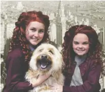  ?? PHOTO BY SANDRA SAM HAHN ?? Tori Smith, left, and Kyra Crosby star in “Annie” at the Cumberland County Playhouse in Crossville, Tenn., through March 2. Making his Playhouse debut as Annie’s lovable mutt Sandy is Benji Reynar Lockhart .