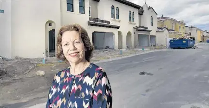  ?? MICHAEL LAUGHLIN/STAFF PHOTOGRAPH­ER ?? Susie Gugliotta is downsizing from a 5-bedroom in Weston to a waterfront townhouse in Artesia, a developmen­t under constructi­on in Sunrise.