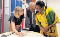  ??  ?? Examining maps from the Penrhyn Papers held at Bangor University Archives are Elen Wyn Simpson, Senior Archivist, Bangor University, His Excellency Seth George Ramocan, Jamaican High Commission­er, and Dr Lola Ramocan.