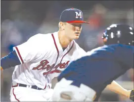  ?? THE CANADIAN PRESS/AP/ROGELIO V. SOLIS) ?? In this April 21, 2017, photo, Mississipp­i Braves pitcher Mike Soroka reacts to a rundown of a Mobile Baybears runner during a minor league Class AA baseball game at Trustmark Park Stadium in Pearl, Miss. John Smoltz, Greg Maddux and Tom Glavine baffled hitters through the 1990s, helping the Atlanta Braves to multiple division titles and a World Series championsh­ip. The Braves are now going back to their strong pitching roots with Canadian Soroka at the forefront.