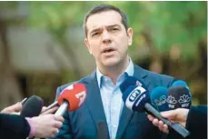  ?? — AFP ?? Greek Prime Minister Alexis Tsipras makes statement to the media after meeting with Greek Defence Minister and coalition partner Panos Kammenos in Athens.