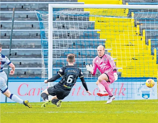  ??  ?? McHugh tucks the ball through the legs of Caley Thistle goalkeeper Mark Ridgers in the 81st minute to make it 2-1 to the hosts