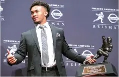  ?? Craig Ruttle/Associated Press ?? ■ Oklahoma quarterbac­k Kyler Murray holds the Heisman Trophy on Dec. 8, 2018. The Oakland Athletics selected Murray ninth overall in the Major League Baseball draft last June. He then went out and won the Heisman Trophy in his only year as Oklahoma’s starting quarterbac­k, declared for the NFL draft last month and picked the NFL over MLB on Monday.