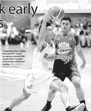  ??  ?? James Yap of Rain or Shine drives past TNT’s Jericho Cruz during a Season 43 PBA Commission­er’s Cup game at the Araneta Coliseum last Saturday.