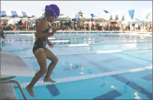  ?? BEA AHBECK/NEWS-SENTINEL FILE ?? Sophia Huerta, 6, hops into the pool as she gets ready to swim during the City of Lodi Swimming Championsh­ips at the Tokay High pool on July 13, 2018.
