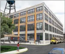  ?? SUBMITTED PHOTO ?? This concept image of the Vision Academy Charter School at 901 Quarry St. by Linn Architects shows the large-scale renovation­s to be done at the crumbling factory. The new facility will be able to house 700 students.