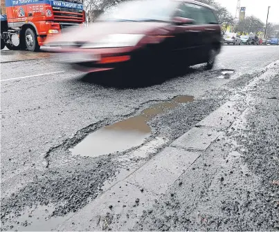  ?? Picture: PA. ?? Holes and other hazards should be repaired quicker and more permanentl­y under the new rules agreed by Perth and Kinross Council.