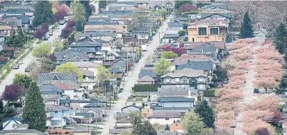  ?? JONATHAN HAYWARD THE CANADIAN PRESS FILE PHOTO ?? For 2020 as a whole, CREA said some 551,392 homes were sold, up 12.6 per cent from 2019, and a new annual record.