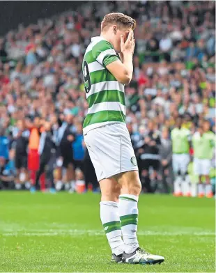  ??  ?? James Forrest reacts after his crucial penalty is saved by Leicester