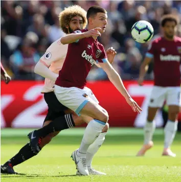  ??  ?? Rich dividends: Luke Shaw (left) and Jesse Lingard (right) have recently signed new deals that will earn them millions in the coming years. Declan Rice’s (above) current contract earns him €3,400 a week
