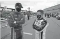  ?? RAOUX/AP JOHN ?? Cody Ware, left, and AJ Allmending­er talk on pit road before an Xfinity Series race Feb. 13 at Daytona Internatio­nal Speedway.