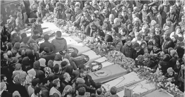  ??  ?? File photo shows Syrian Kurds mourn during a funeral in the town of Afrin, of civilians and fighters from the Syrian Kurdish People’s Protection Units (YPG) who were killed in battles in Syria’s border region of Afrin as the Turkish army press an...