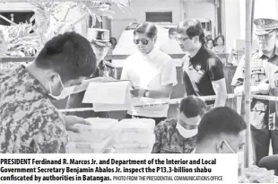  ?? PHOTO From THE Presidenti­al Communicat­ions OFFICE ?? President Ferdinand r. Marcos Jr. and department of the interior and Local Government secretary Benjamin Abalos Jr. inspect the P13.3-billion shabu confiscate­d by authoritie­s in Batangas.