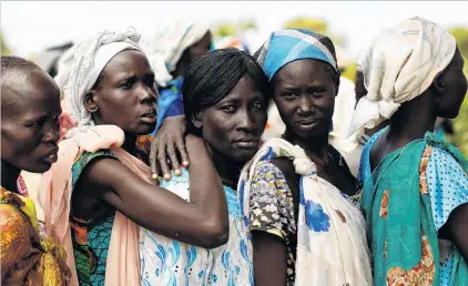  ?? PHOTO: REUTERS ?? Uprooted . . . Women wait in line during a Unicef supported mobile health clinic in the village of Rubkuai, Unity State, South Sudan.